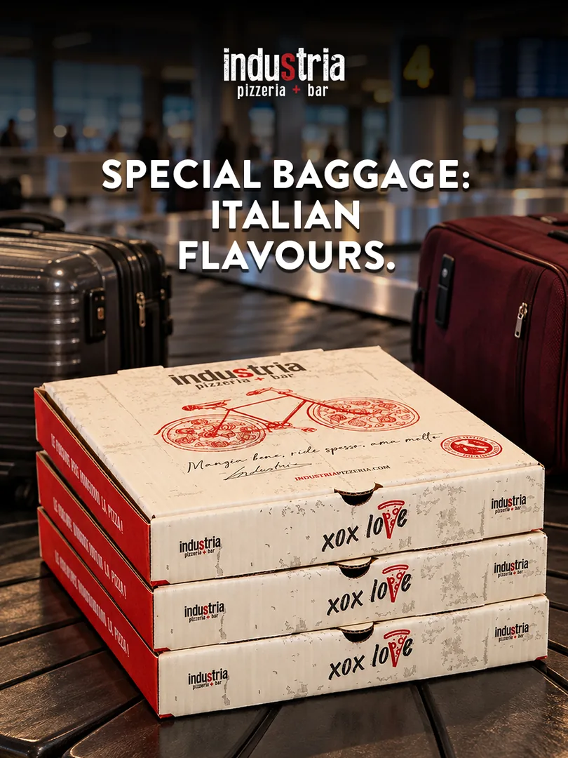 Industria YUL teaser: pizza boxes travelling on an airport baggage carousel
